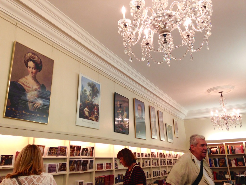 Chandeliers and framed prints continue the illusion of private space, an unusual intrusion into a typical retail space but in line with the Gilded Age experience of the Frick Collection