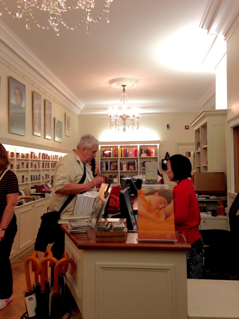 A customer and staff member talk over a purchase 