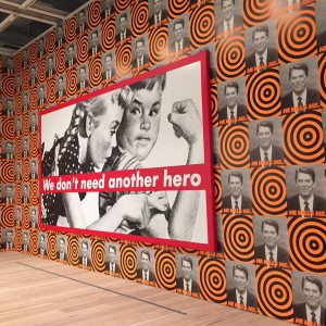 Whitney Museum of American Art exhibition "America is Hard to See" includes Barbara Kruger's "We Don't Need Another Hero" on a wall of Visual Arts/ACT-UP posters.